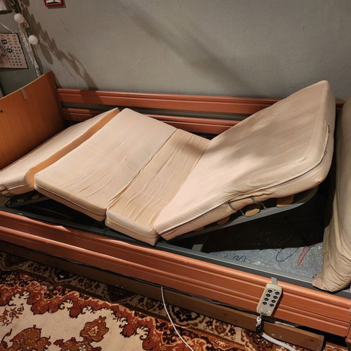 Electric hospital bed used with headboard