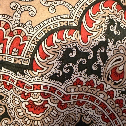 Large square scarf used in green and red