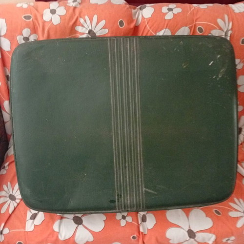 Vintage suitcase used with dark green color and quilted lining