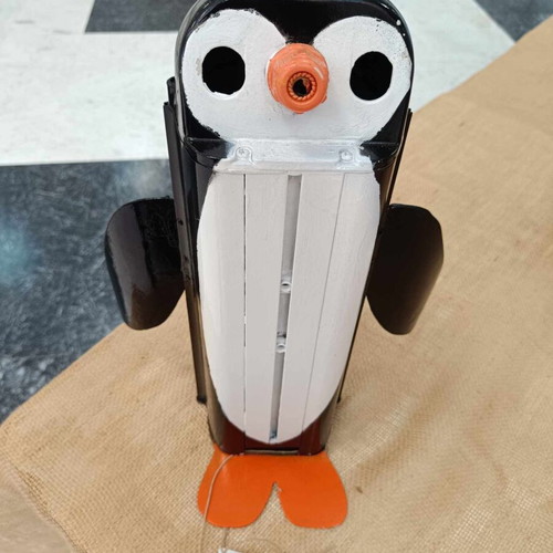 Decorative penguin like new made from recycled CCTV camera