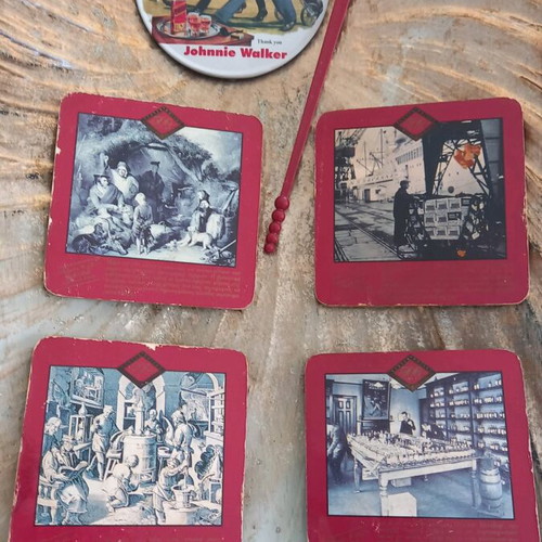 Johnnie Walker collectible set like new with 5 coasters and stirrer