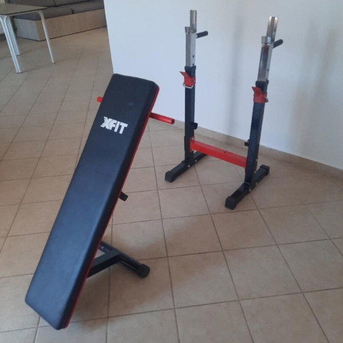 X-FIT gym bench like new with barbell stands