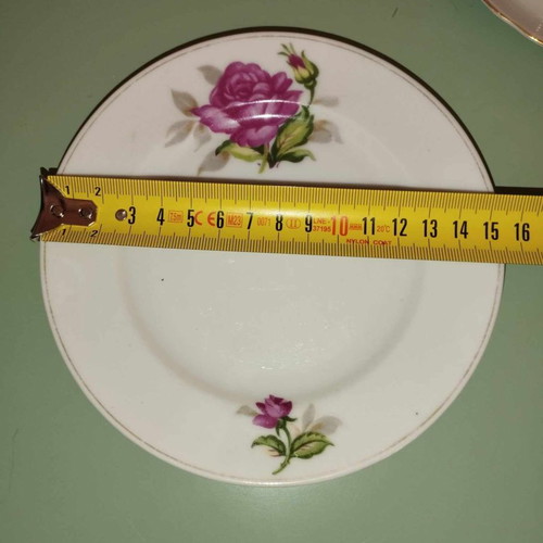Vintage porcelain cup and saucer set with fuchsia roses