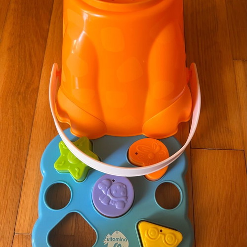 Beach bucket with shape sorting toy used