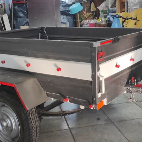 Trailer bag carrier used with removable and folding plywood lid