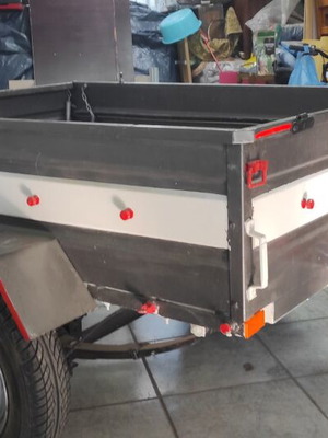 Trailer bag carrier used with removable and folding plywood lid