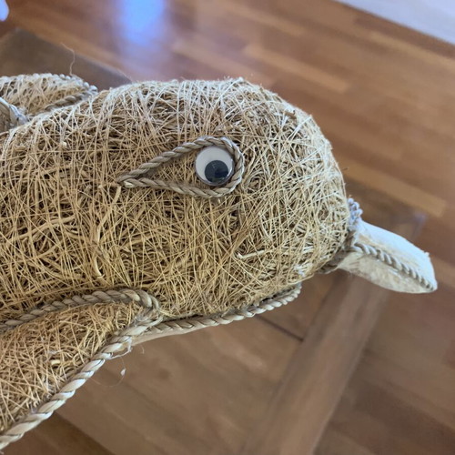 Handmade decorative dolphin made of grass