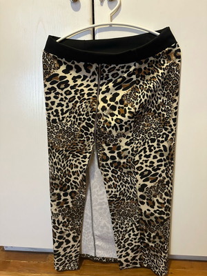 Long fitted animal print skirt like new with slit and zipper