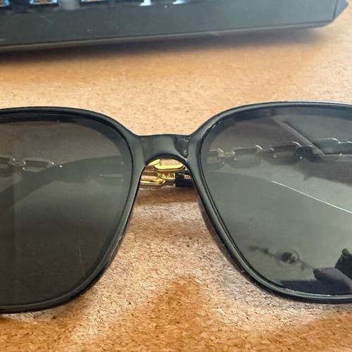 Sunglasses with black oversized frame and gold chain decoration, new