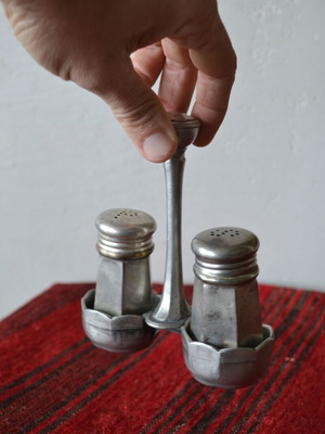 Vintage salt and pepper set used, metal case pewter with embossed details
