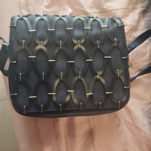 Shoulder bag like new with unique oval design, black