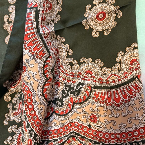 Large square scarf used in green and red