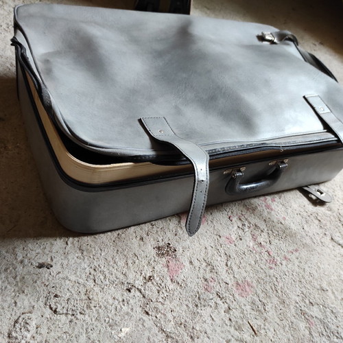 Leather suitcase old used, gray with broken zipper