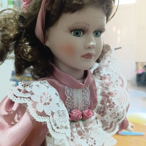 Porcelain doll used with cracked forehead from fall