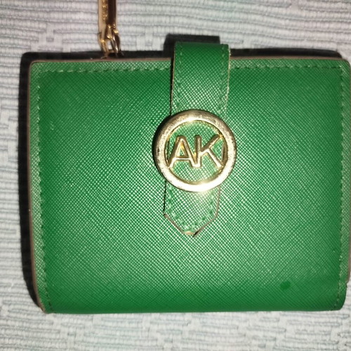 Small green wallet used