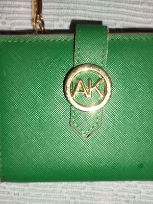 Small green wallet used