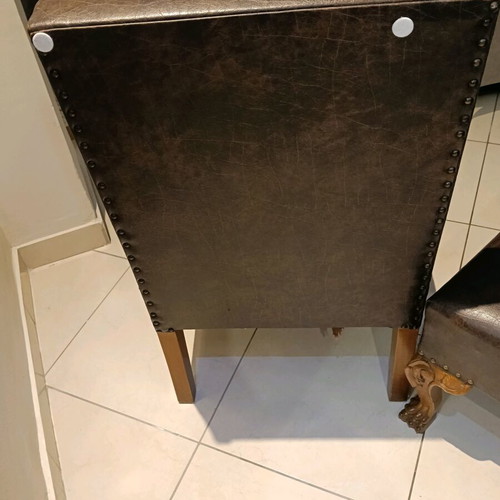 Set of two low chairs used with leatherette and wooden frame