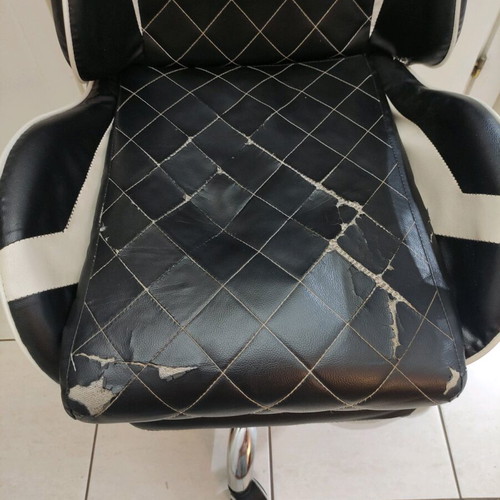 Gaming chair used with footrest made of leatherette