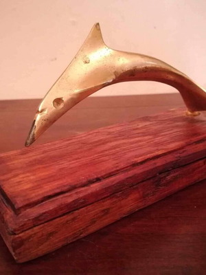 Metal small decorative dolphin on wooden base 10cm