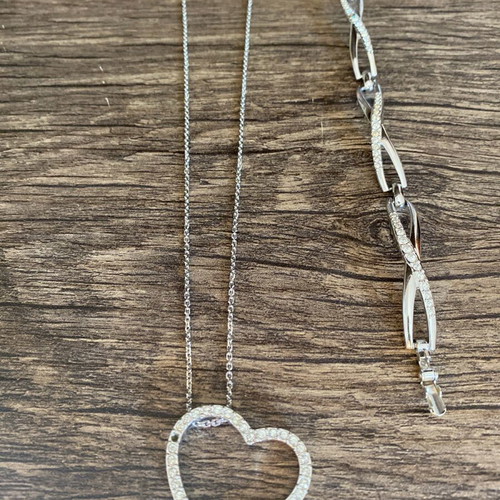 Swarovski necklace and bracelet set like new, silver with missing stones