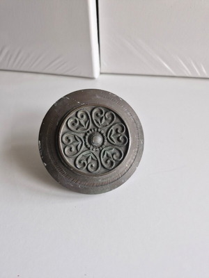 Old door knob used, embossed round bronze