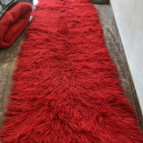 Red flokati rugs used, large pieces, pack of 2