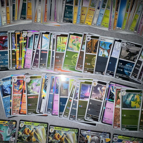 Pokemon bulk cards set with 125 non-foil and 58 foil cards