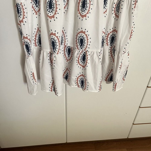 Dress with eye motifs and ruffles on sleeves and hem one size new