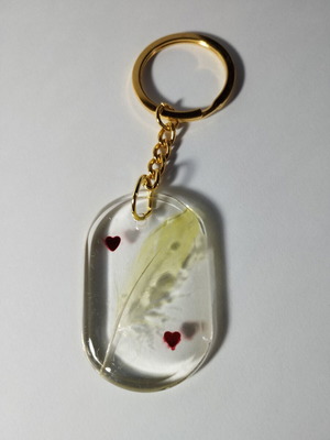 Handmade keychain with feather and hearts, like new