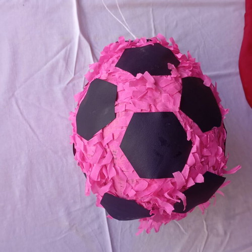 Piñata in the shape of a soccer ball like new, pink and black