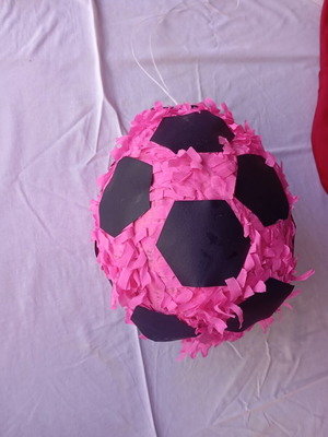 Piñata in the shape of a soccer ball like new, pink and black