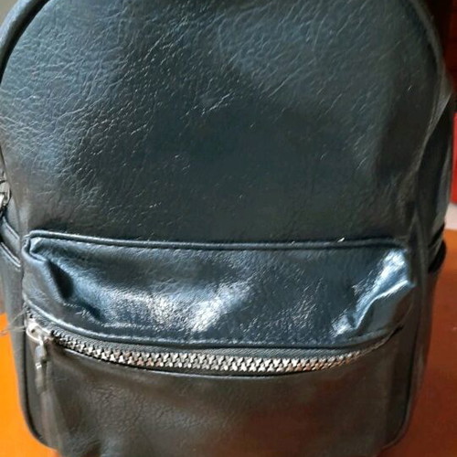 Backpack black medium made of eco leather with silver zippers like new
