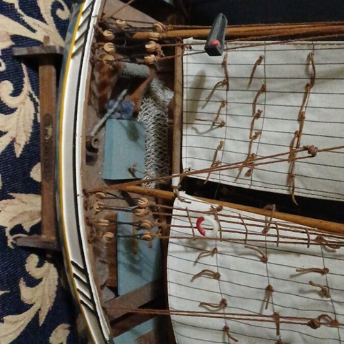 Decorative wooden ship and large handcrafted wooden boat