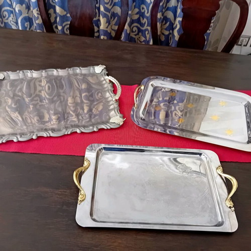 Set of three used serving trays, stainless steel inox 18/10 with gold details