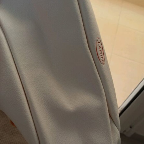 Clarins cosmetic bag new, white with striped handles