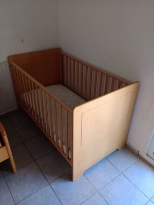 Wooden baby cot used with mattress