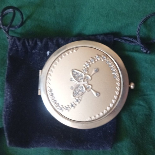 Compact mirror with gold-tone metal case and butterfly decoration, like new