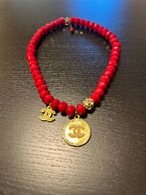 Necklace with red beads and gold-tone pendant with pearls like new