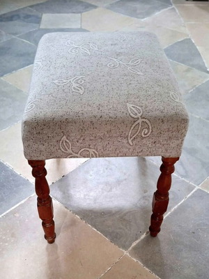 Upholstered Footstool like new with wooden legs