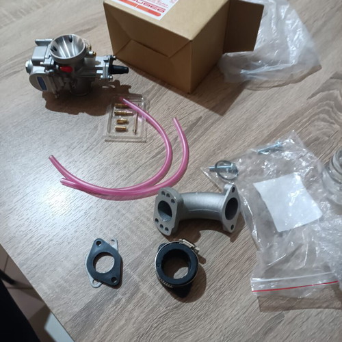 Carburetor 24mm new with extra needle, jet, neck, screws, and rubber mouth