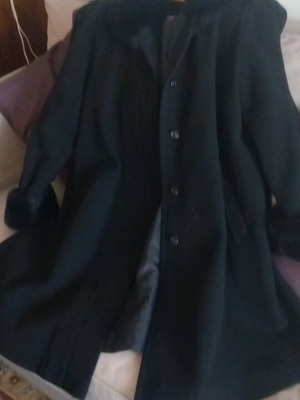 Black coat with synthetic fur on sleeves and collar, lined, excellent condition, size L/XL