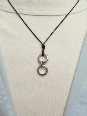 Men's black pendant with silver circles