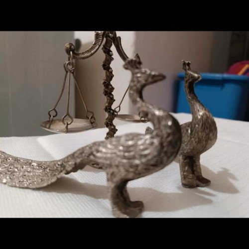 Vintage metal scale and decorative peacocks used
