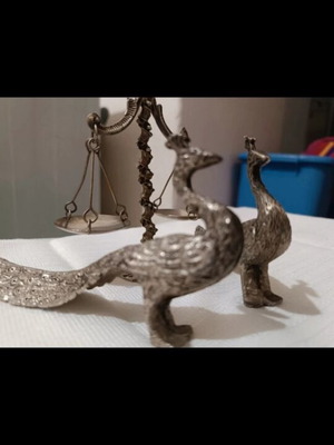 Vintage metal scale and decorative peacocks used