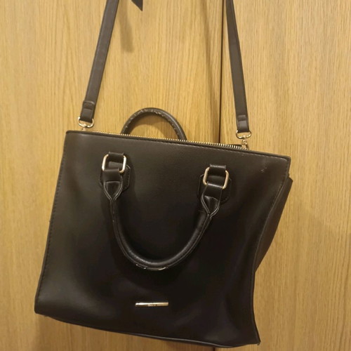 Handbag used with crossbody strap and spacious interior