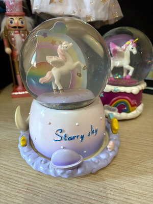 Unicorn-themed glass music snow globe, color-changing, rotating