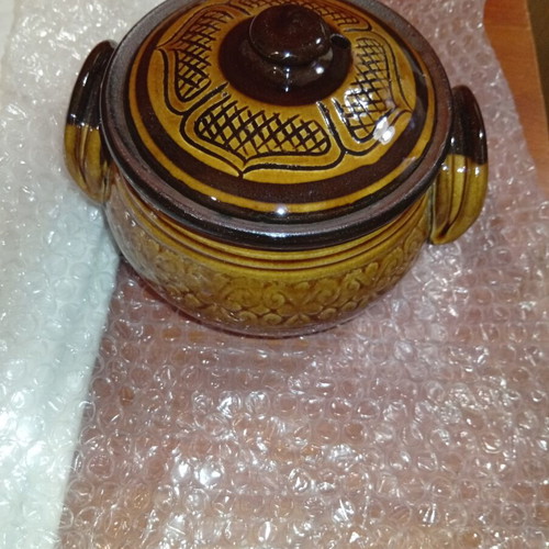 Traditional ceramic clay pot with lid and side handles