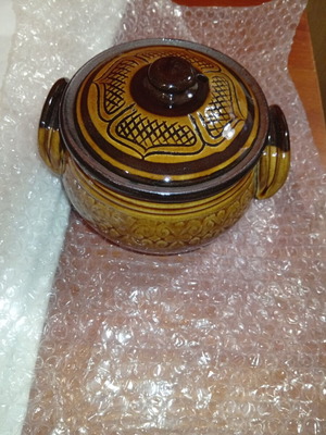 Traditional ceramic clay pot with lid and side handles