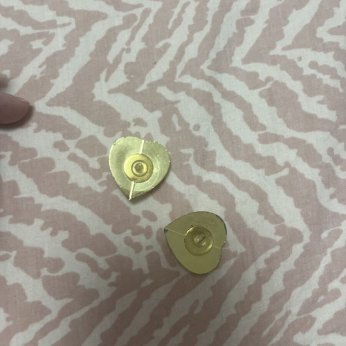 Earrings used heart-shaped gold tone with white center