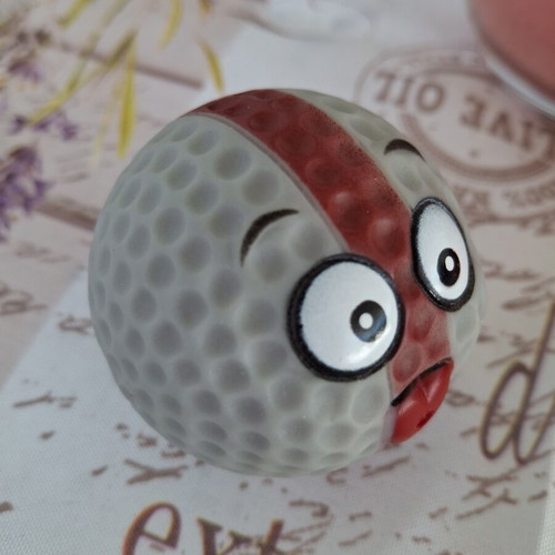 Set of 2 rubber squeaky balls with funny faces